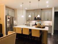 Previous model home* Pick your own countertop - upgrades shown (lighting package included)