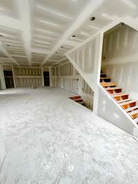 Spacious Living Room looking into Kitchen.