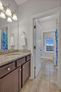 View of the shared bath to the second vanity area. Second vanity area opens directly from Bedroom 4.