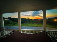 Sunrise views from the upper balcony on the front of the house. Bedrooms 3 & 4 have french door access to upper balcony.