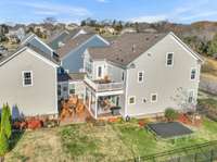 Aerial view of sideyard and outdoor living spaces.