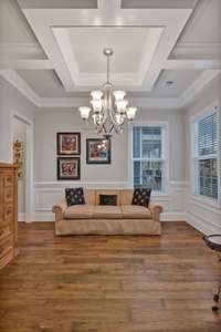 Formal dining is currently used as a music & listening room.  Wainscoting and coffered ceiling are upgrades.