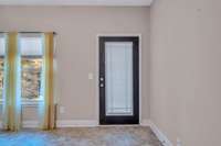 VIEW OF FLORIDA ROOM WITH ENTRY WAY AND LOTS OF NATURAL LIGHT !!!!!