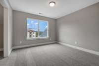 One of two second floor bedrooms.