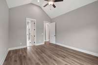 The large Primary bedroom features a vaulted ceiling.