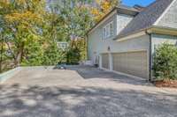 Three car garage and large parking pad.  Built-in basketball goal REMAINS. Garage has storage shelves and opens on the main level just outside the kitchen.