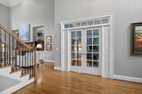 Formal office has french doors with a transom for valued privacy.