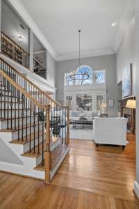 Staircase to upper level and library/homework station which overlooks the living area.