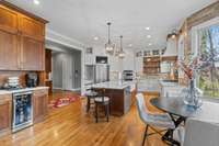 Kitchen was reconfigured in 2018.  Coffee bar or wine bar with beverage fridge.  Built-in informal dining area.  Charging station is to the left of the SS French door refrigerator.