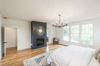 Primary bedroom complete with its own fireplace.