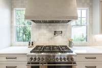 Double oven, 8 burners, pot-filler, and custom vent hood!