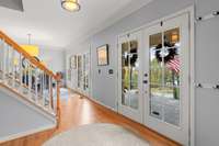 Three sets of French doors lead to the front porch.