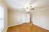 Third Bedroom features crown molding, ceiling fan and double door closet.