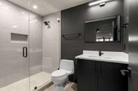 Full bathroom in the basement. Walk-in shower with niche.