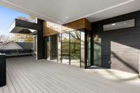 Just outside the front bedroom is an outdoor patio. Great for a conversation set.