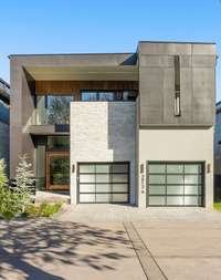 Designed by Richland Builders, the exterior is stucco, hardi board, and stone
