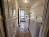 Mudroom/Laundry room entry from the backdoor.