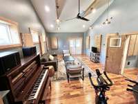 This room is very versatile, having most recently served as a music studio, complete with its own exterior entrance and half bath. Alternatively, it could easily transform into another living area, guest ensuite, or home gym, catering to your needs