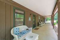 A true covered rocking chair front porch on guest house