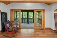 The amazing screened porch above the garage has vaulted ceilings and French doors.