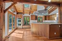 Soaring ceilings with skylights bring in amazing natural light in the heart of this home