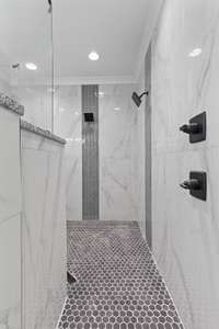 Primary Bathroom suite has two vanities, one of each side of this extra space, a soaking tub, and a dual-head shower.