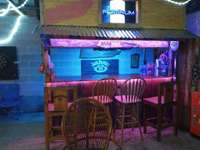 The bar and garage TV go with the sale of the home for your own man-cave or she-shed. It is great for entertainment.