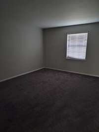 One of the two bedrooms with new carpet and full bath.