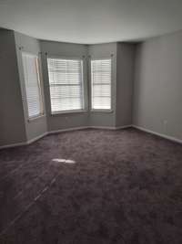 Large living room with bay window.