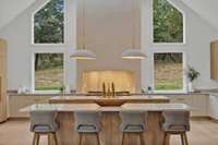 The quartz, the cabinets, the light fixtures, the windows....the obvious beautiful elements of this kitchen before we even mention the appliances and the great functionality.