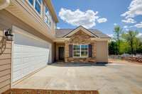 Magnolia entry and two car garage.