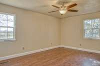 GUEST BEDROOM WITH NEW WOOD FLOORING & NEW CEILING FAN