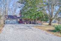 NESTLED ON OVER A HALF ACRE LOT IN QUIET, ESTABLISHED AREA