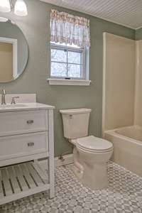 GUEST FULL BATH COMPLETELY REMODELED. TILE FLOORING