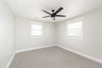 One of the two bedrooms on the upper level - both have new carpet and are cleanly painted.