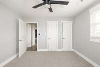 The second bedroom on the upper level - both bedrooms feature his and hers wardrobes.