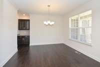 Formal Dining Room and Butler's Pantry. Photo is of a similar floor plan, not actual home.