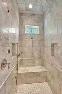 Marble walk-in shower.