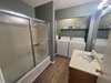 Washer and dryer are located in the bathroom providing easy access to laundry