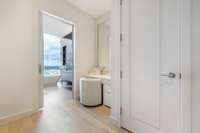 The primary bedroom features two separate bathrooms and closets.