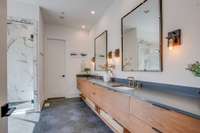 Master bath with beautiful geometric tile floor and walk in shower.