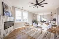 Living Room with Electric Fireplace and lots of natural light