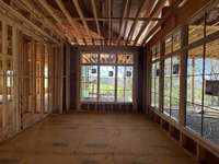 Spacious Dining Room with beautiful views of rollings hills and lots of privacy. Built by: Legend Homes  Photo taken 3/21/24