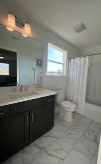 3rd Full bath upstairs in the Oakwood Model. Previously built home, actual finishes may vary