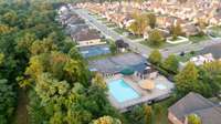 Neighborhood amenities include two pools, a basketball court, pavilion with picnic tables, and a playground