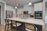 The kitchen was remodeled in January 2023 and features a marble backsplash, quartz countertops, and separate hot water tap