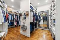 Large walk-in closet with custom shelving.