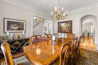 Butlers pantry and walk-in pantry is quietly tucked between the kitchen and dining room in the arched doorway seen in this picture.