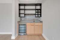 Wet bar with wine cooler and alcohol storage