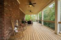 Gorgeous 12x38 covered porch, right off of the kitchen for more entertaining space! Faces the private woods in the back yard.